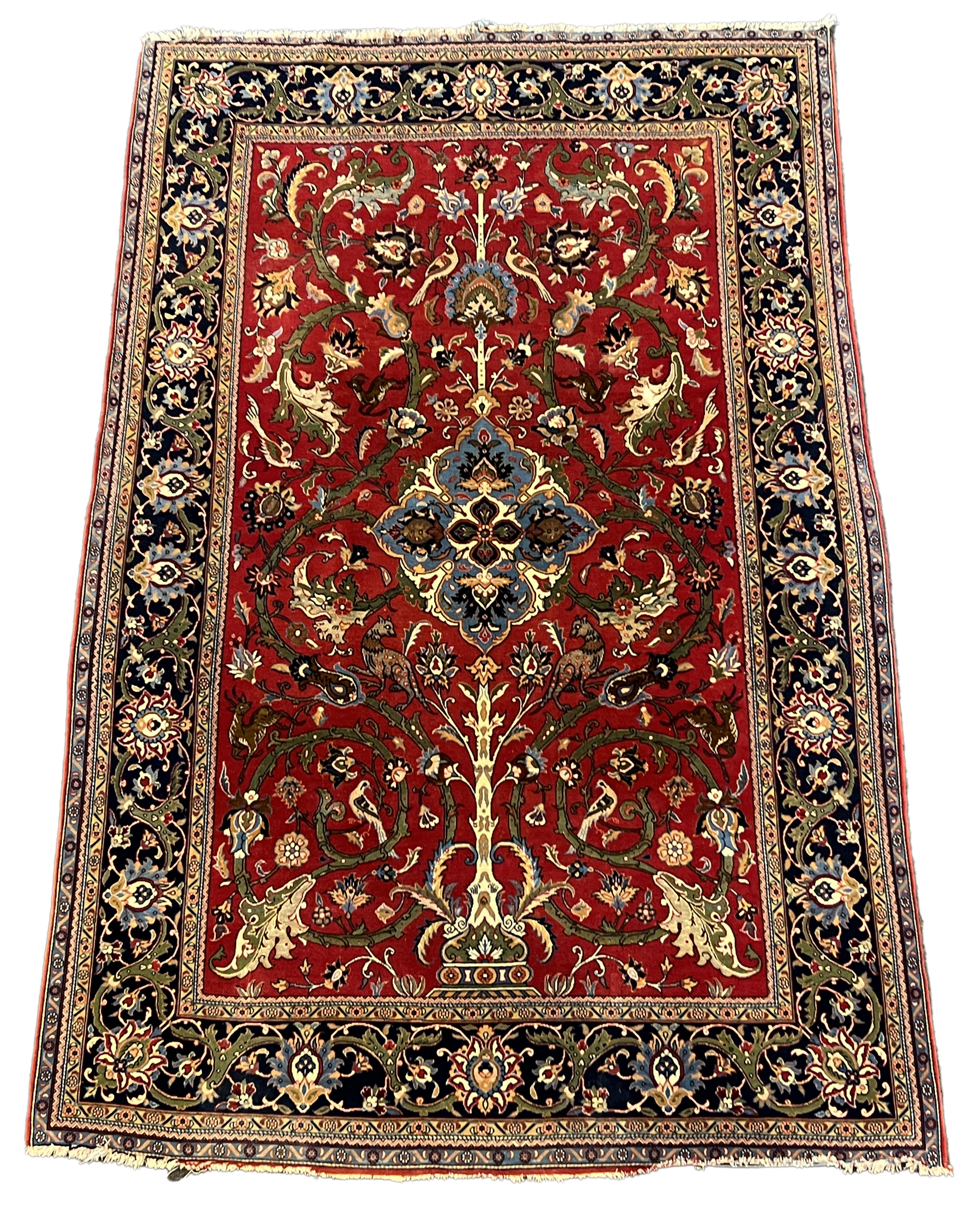 A Kashan red ground rug, woven with scrolling foliage and birds within a dark border, 216 x 138cm. Condition - good
